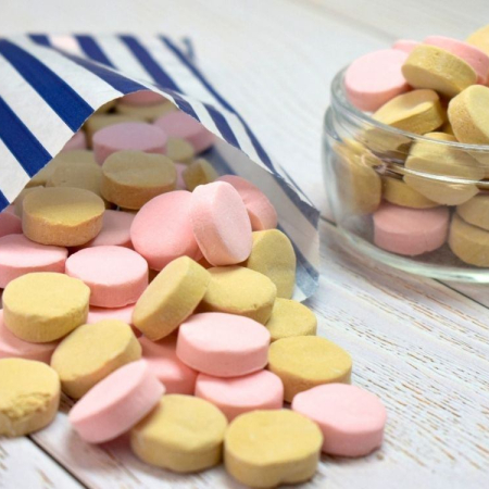 Ross's Aromatics sweets pink and grey floral-flavoured hard sweets in a paper bag
