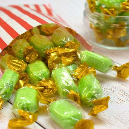 Chocolate limes in a paper bag, a green lime-flavoured boiled sweet with a soft chocolate centre