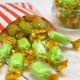 Chocolate limes in a paper bag, a green lime-flavoured boiled sweet with a soft chocolate centre
